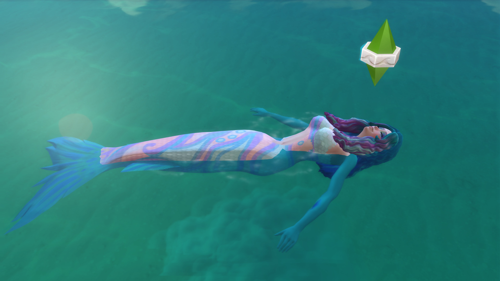 Sims 4 mermaid with colourful tail and hair floating peacefully in the ocean