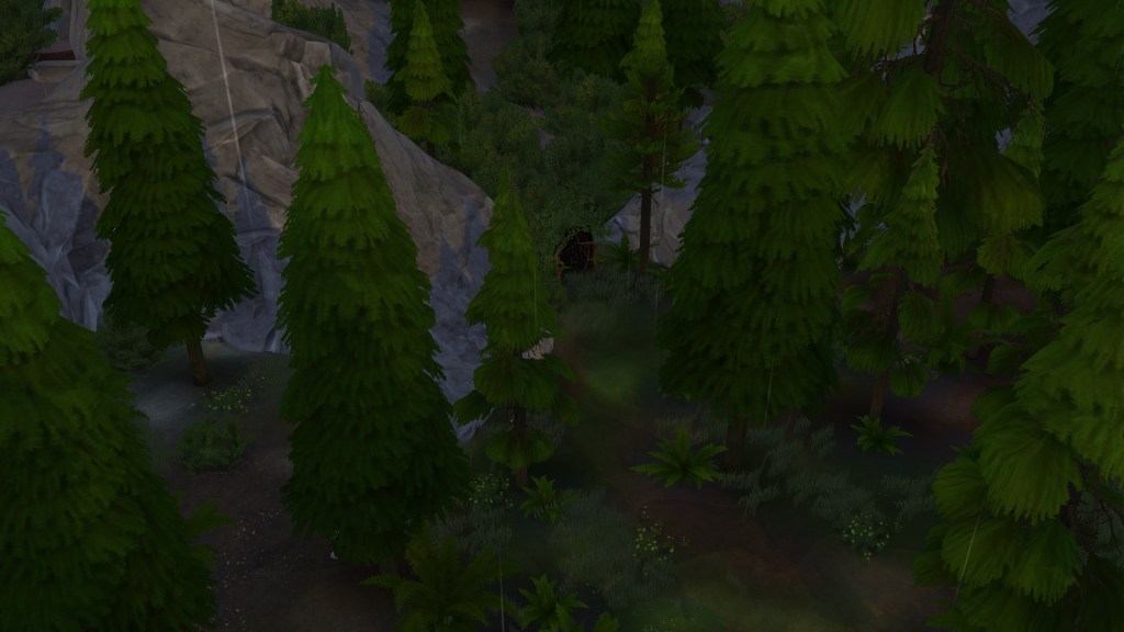A Sim stands beside a shrub-covered cave behind the Granite Falls park lodge.
