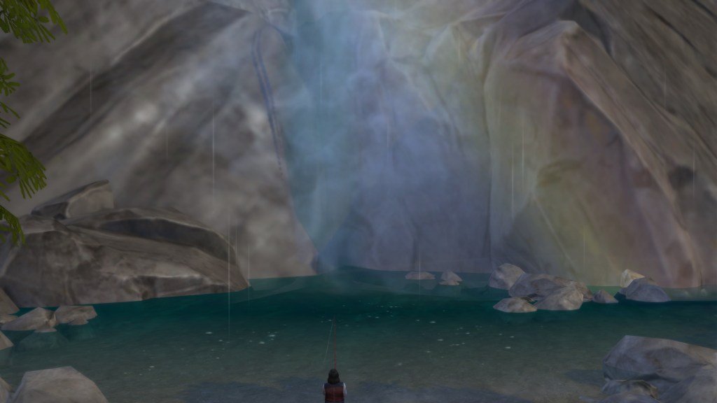 Golden hour light over the Deep Woods waterfall with mist rising from the pool.