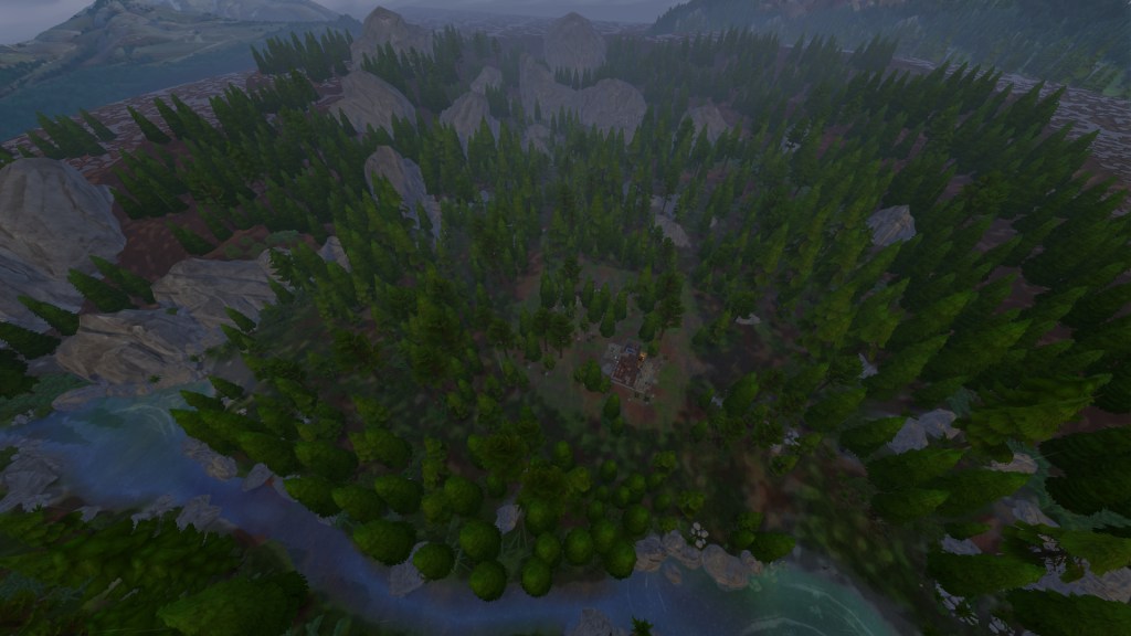 A wide shot of Deep Woods in Granite Falls showing pine forests, cliffs, and a cascading waterfall.