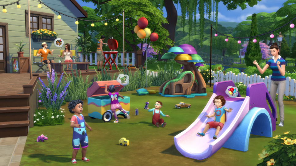 Toddlers playing together in a colourful outdoor play area.